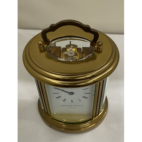 22 - A VINTAGE MATTHEW NORMAN OF LONDON, BRASS 8 DAY OVAL CARRIAGE CLOCK, WITH KEY, WORKING AT TIME OF CA... 