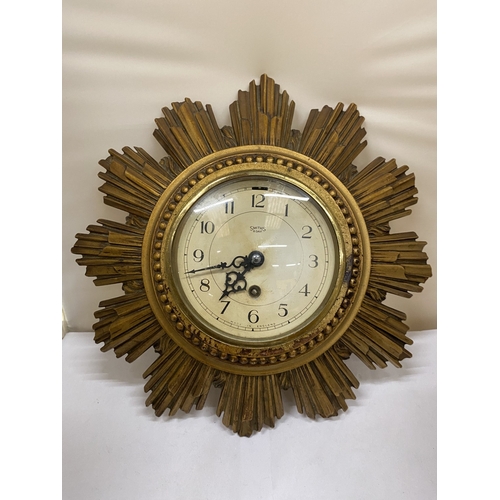 32 - A SMITHS GILT 8 DAY SUNBURST CLOCK, DIAMETER 30CM (KEY IN OFFICE)