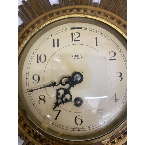 32 - A SMITHS GILT 8 DAY SUNBURST CLOCK, DIAMETER 30CM (KEY IN OFFICE)