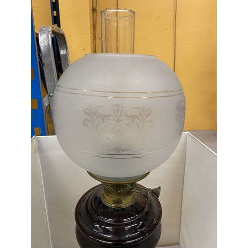 33 - A VINTAGE OIL LAMP WITH BRASS CORINTHIAN COLUMN, FROSTED GLASS SHADE AND FUNNEL, HEIGHT 62CM