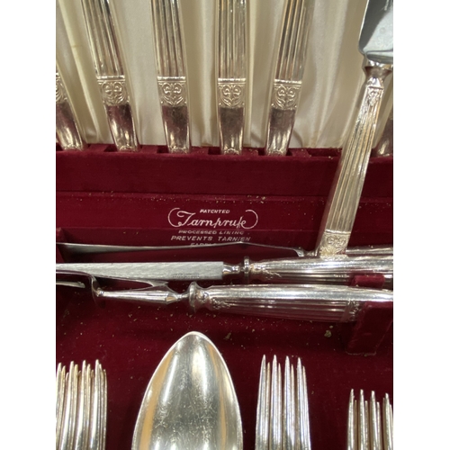 9 - A VINTAGE ELKINGTON CANTEEN OF CUTLERY IN A FITTED BURR WALNUT BOX