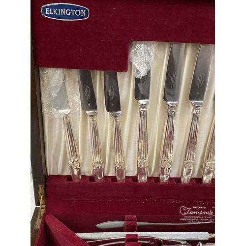 9 - A VINTAGE ELKINGTON CANTEEN OF CUTLERY IN A FITTED BURR WALNUT BOX