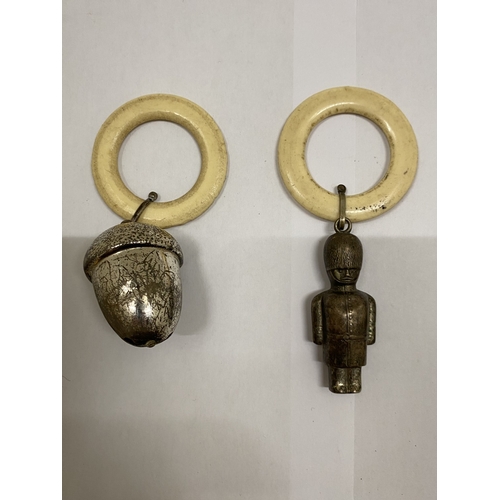 40 - THREE VINTAGE WHITE METAL RATTLES, AN ACORN, POLICEMAN AND SOLDIER