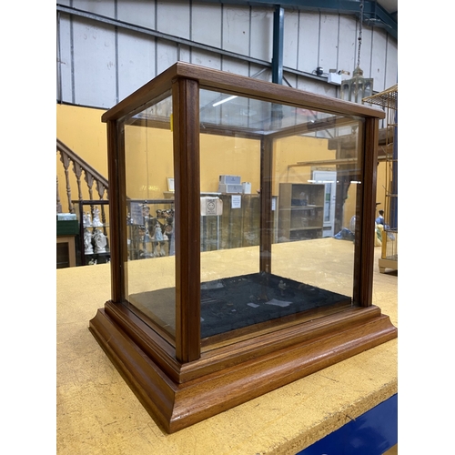 50 - A WOODEN FRAMED GLASS DISPLAY UNIT