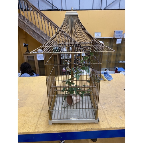 51 - A PAGODA STYLE METAL BIRD CAGE, HEIGHT 70CM