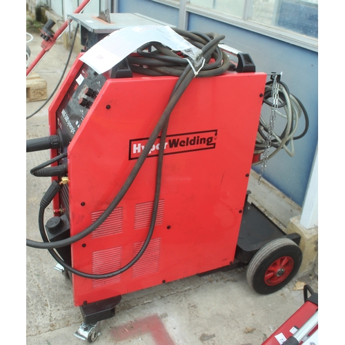 76 - A HYPERWELDING MIG500 SYNERGIC MIG WELDER WITH FOUR WHEELED TROLLEY BASE  NO VAT