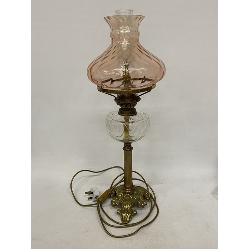 50A - A VICTORIAN STYLE LAMP IN THE MANNER OF AN OIL LAMP WITH GLASS SHADE AND CHIMNEY, HEIGHT APPROX 68CM