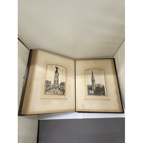 23 - A LEATHER BOUND VICTORIAN PHOTO ALBUM, CONTAINING PHOTOS AND POSTCARDS