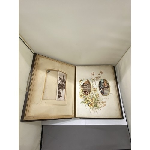 23 - A LEATHER BOUND VICTORIAN PHOTO ALBUM, CONTAINING PHOTOS AND POSTCARDS