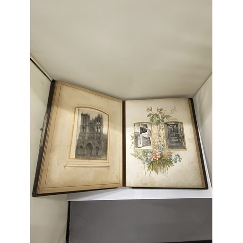 23 - A LEATHER BOUND VICTORIAN PHOTO ALBUM, CONTAINING PHOTOS AND POSTCARDS