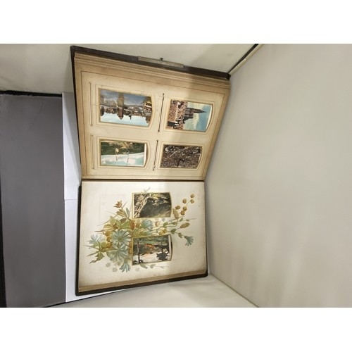 23 - A LEATHER BOUND VICTORIAN PHOTO ALBUM, CONTAINING PHOTOS AND POSTCARDS