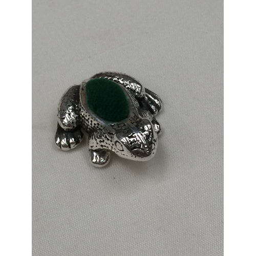 34 - A SILVER FROG PIN CUSION