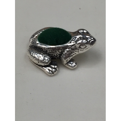34 - A SILVER FROG PIN CUSION