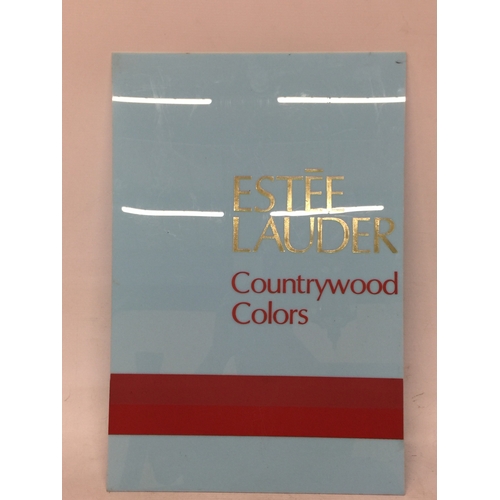 12 - AN ESTEE LAUDER 'COUNTRYWOOD COLORS' POINT OF SALE ADVERTISING BOARD, 58CM X 39CM