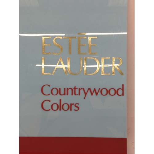 12 - AN ESTEE LAUDER 'COUNTRYWOOD COLORS' POINT OF SALE ADVERTISING BOARD, 58CM X 39CM