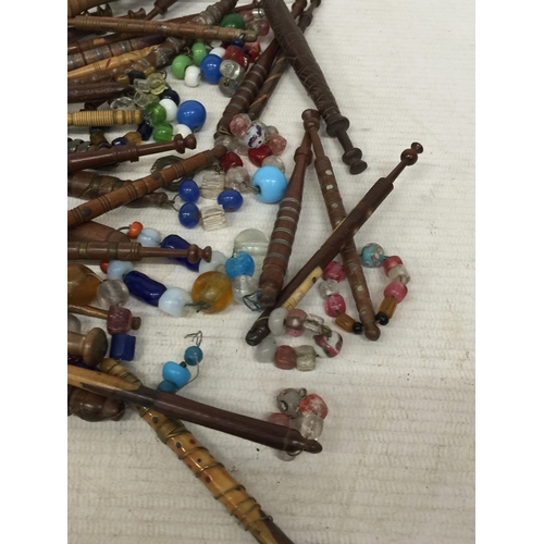 13 - A COLLECTION OF FIFTY SEVEN, 19TH CENTURY TURNED WOOD LACE BOBBINS, TO INCLUDE METAL MOUNTED, WIRE W... 