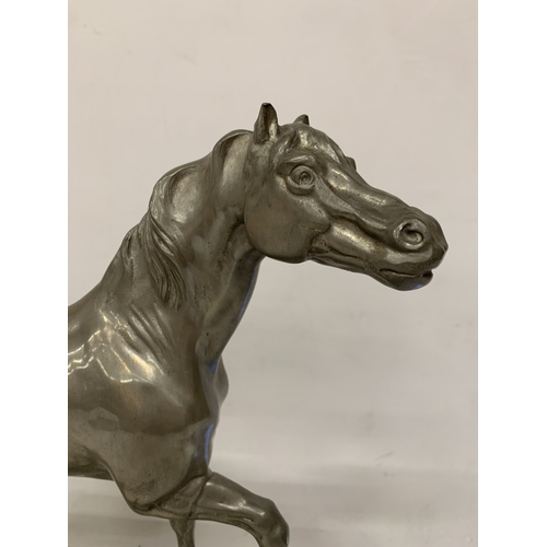 2 - A LARGE PEWTER MODEL OF A HORSE, ON A PLINTH, HEIGHT  37CM, WIDTH 31CM
