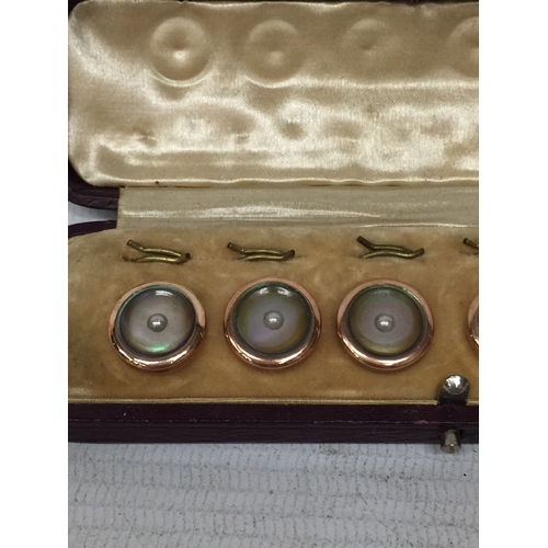 21 - A SET OF SIX GOLD PLATED AND MOTHER OF PEARL BUTTONS IN A PRESENTATION BOX