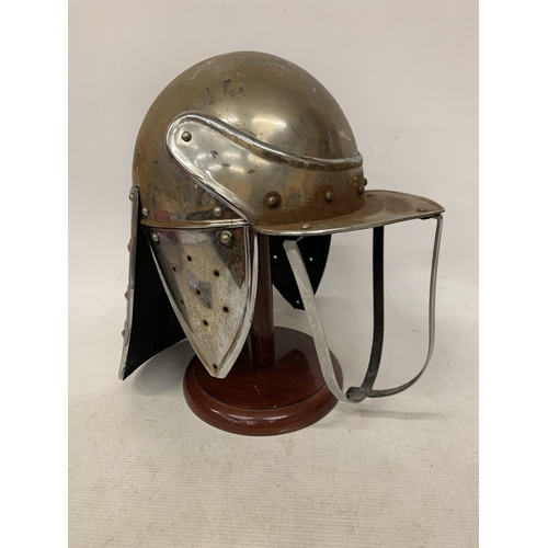 4 - A REPLICA CIVIL WAR LOBSTER POT RIDING HELMET ON A WOODEN STAND