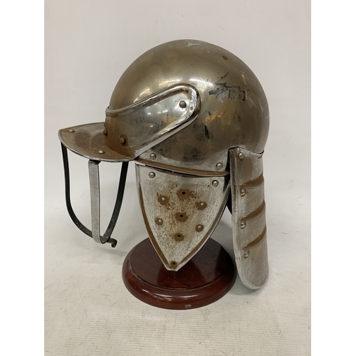 4 - A REPLICA CIVIL WAR LOBSTER POT RIDING HELMET ON A WOODEN STAND