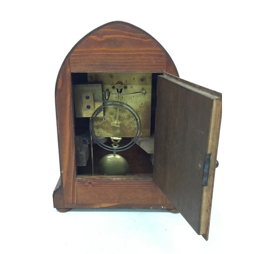 9 - A VINTAGE OAK, GOTHIC STYLE CHIMING MANTLE CLOCK, WITH A PRESENTATION PLAQUE TO THE FRONT FOR 1920