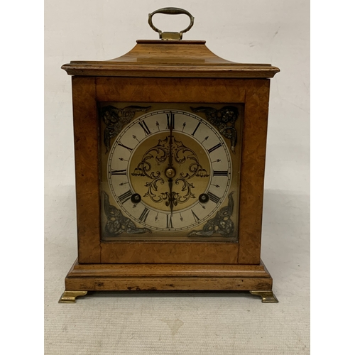 47 - A VINTAGE OAK  CASED CHIMING MANTLE CLOCK