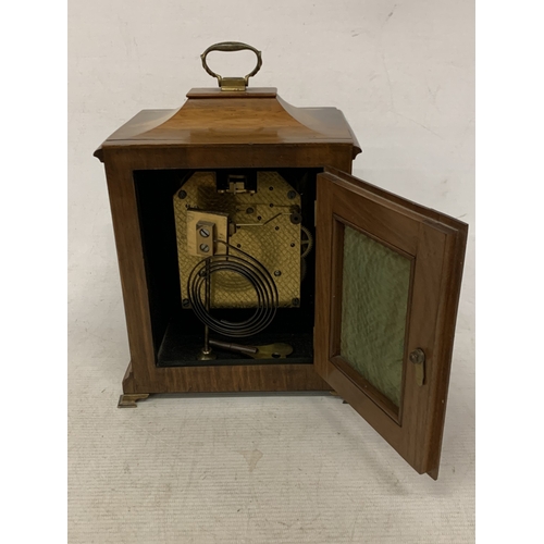 47 - A VINTAGE OAK  CASED CHIMING MANTLE CLOCK