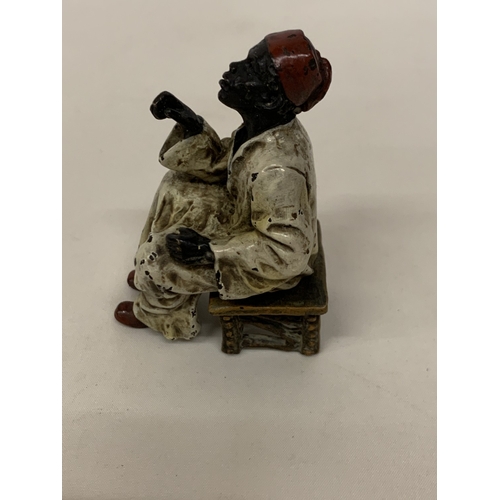 52 - A COLD PAINTED BERGMANN BRONZE OF A SEATED AFRICAN, HEIGHT 8CM