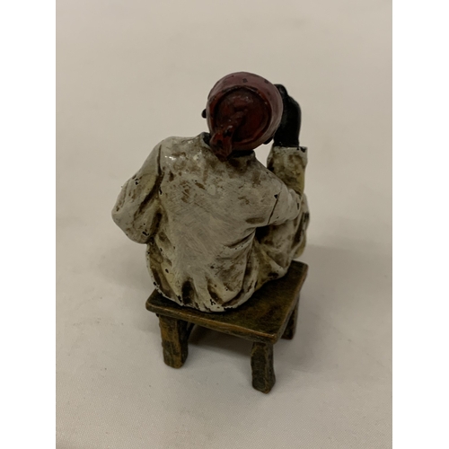52 - A COLD PAINTED BERGMANN BRONZE OF A SEATED AFRICAN, HEIGHT 8CM