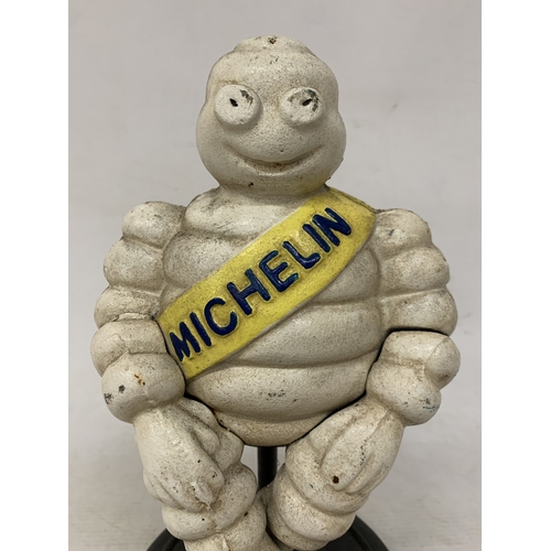 58 - A CAST SITTING MICHELIN MAN FIGURE, HEIGHT 29CM