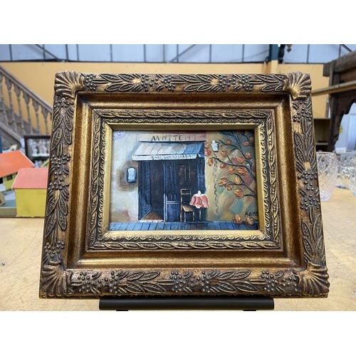 48 - A SMALL OIL PAINTING OF A CAFE IN A GILT FRAME ON AN EASEL, 25CM X 30CM