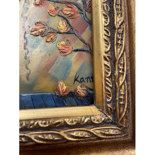 48 - A SMALL OIL PAINTING OF A CAFE IN A GILT FRAME ON AN EASEL, 25CM X 30CM
