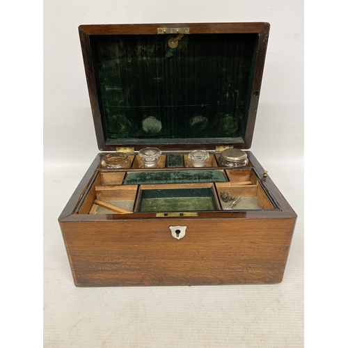 32 - A ROSEWOOD VANITY BOX  WITH CONTENTS WITH INLAID MOTHER OF PEARL AND A SECRET DRAWER