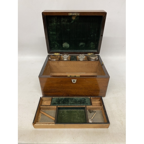 32 - A ROSEWOOD VANITY BOX  WITH CONTENTS WITH INLAID MOTHER OF PEARL AND A SECRET DRAWER