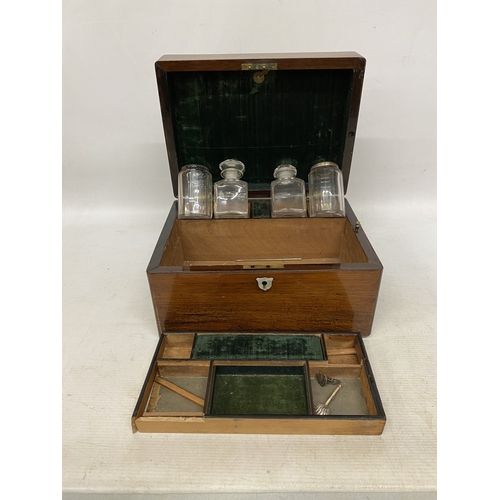 32 - A ROSEWOOD VANITY BOX  WITH CONTENTS WITH INLAID MOTHER OF PEARL AND A SECRET DRAWER