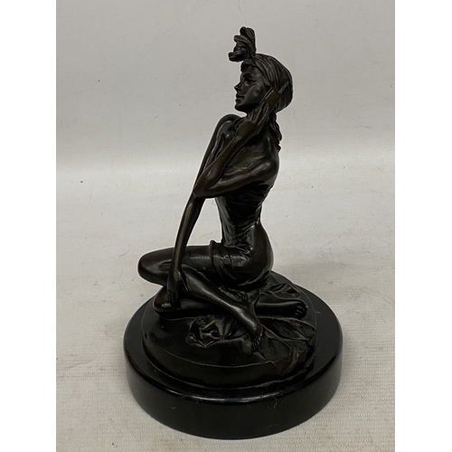 33 - A BRONZE SCULPTURE OF A WOMAN IN DRESS WITH PHONE ON A MARBLE BASE - SIGNED