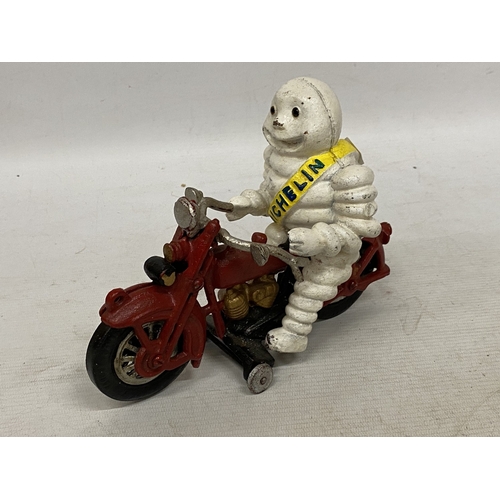 34 - A CAST MICHELIN MAN ON A MOTORBIKE