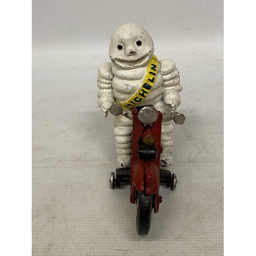 34 - A CAST MICHELIN MAN ON A MOTORBIKE