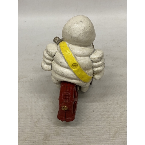 34 - A CAST MICHELIN MAN ON A MOTORBIKE