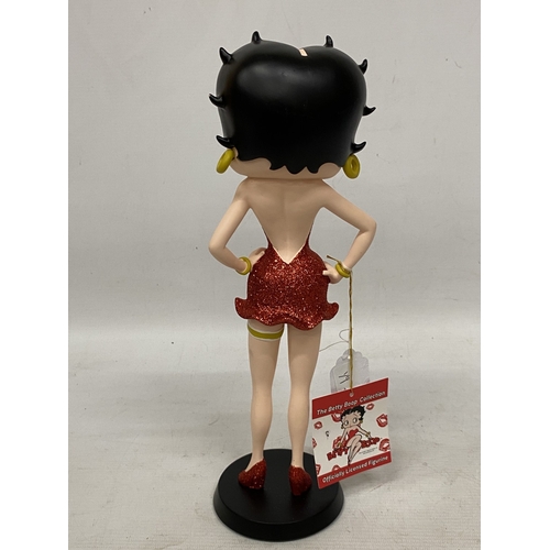 41 - A BETTY BOOP FIGURE IN A RED GLITTER DRESS