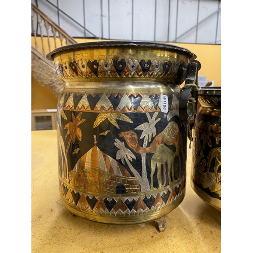 49 - TWO HAND-CRAFTED TUNISIAN COPPER AND BRASS FOOTED ICE BUCKETS WITH DESERT SCENES