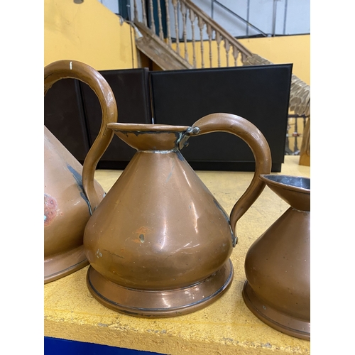 48 - A COLLECTION OF SIX BRASS AND COPPER GRADUATED MEASURING JUGS