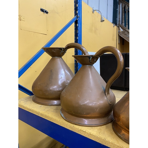48 - A COLLECTION OF SIX BRASS AND COPPER GRADUATED MEASURING JUGS