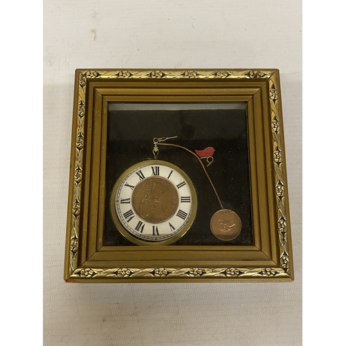 A POCKET WATCH STYLE CHAIN WALL CLOCK IN THE SHAPE OF A PENNY FARTHING ...