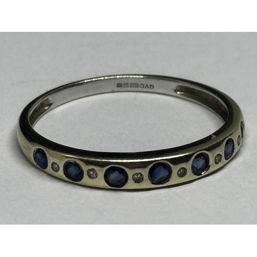 A MARKED 9 CARAT WHITE GOLD RING WITH SEVEN SAPPHIRES AND SIX DIAMONDS ...