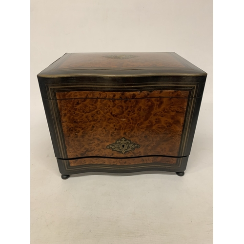 9 - A CONTINENTAL MAHOGANY LIQUEUR CABINET WITH INNER FITTINGS, A BURR WALNUT VENEER AND BUN FEET, HEIGH... 