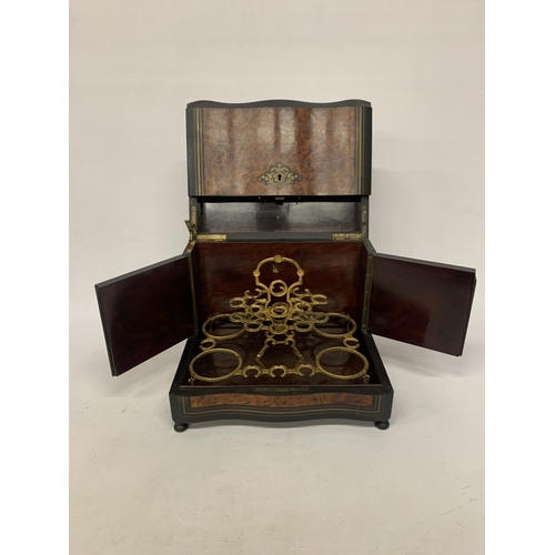 9 - A CONTINENTAL MAHOGANY LIQUEUR CABINET WITH INNER FITTINGS, A BURR WALNUT VENEER AND BUN FEET, HEIGH... 