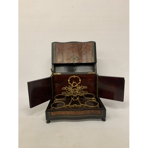 9 - A CONTINENTAL MAHOGANY LIQUEUR CABINET WITH INNER FITTINGS, A BURR WALNUT VENEER AND BUN FEET, HEIGH... 