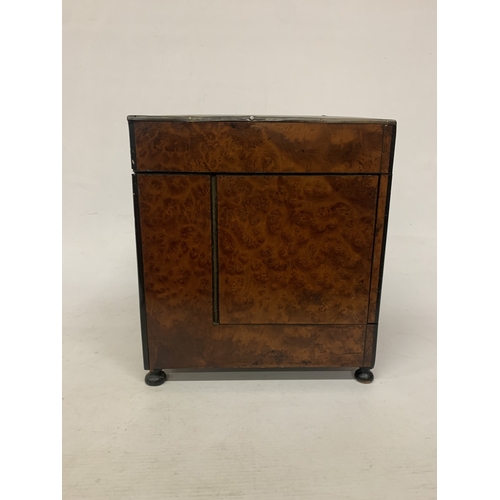 9 - A CONTINENTAL MAHOGANY LIQUEUR CABINET WITH INNER FITTINGS, A BURR WALNUT VENEER AND BUN FEET, HEIGH... 