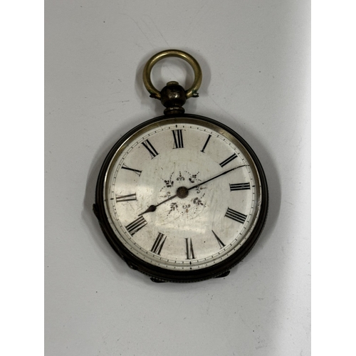 623 - A SILVER FOB WATCH WITH DECORATIVE WHITE ENAMEL WITH ROMAN NUMERALS SEEN WORKING BUT NO WARRANTY GIV... 